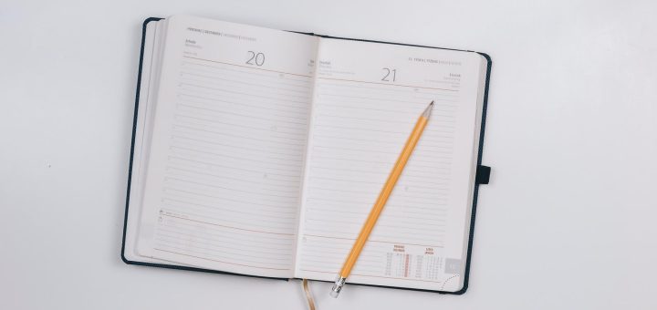 pencil on opened notebook