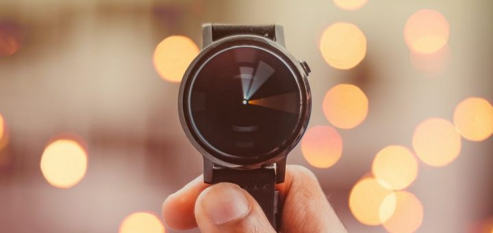 round silver-colored smartwatch bokeh photography