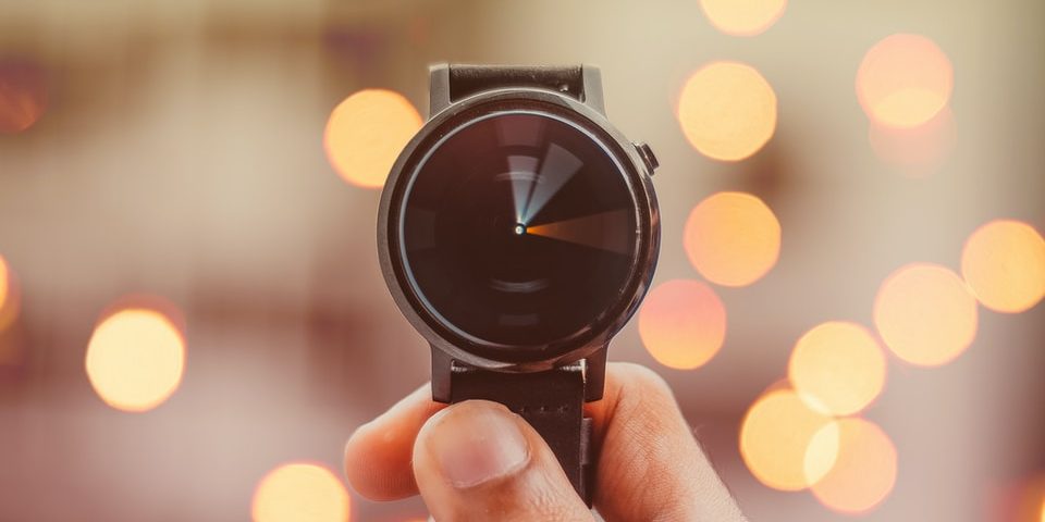round silver-colored smartwatch bokeh photography