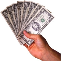 Money in hand - save by being frugal